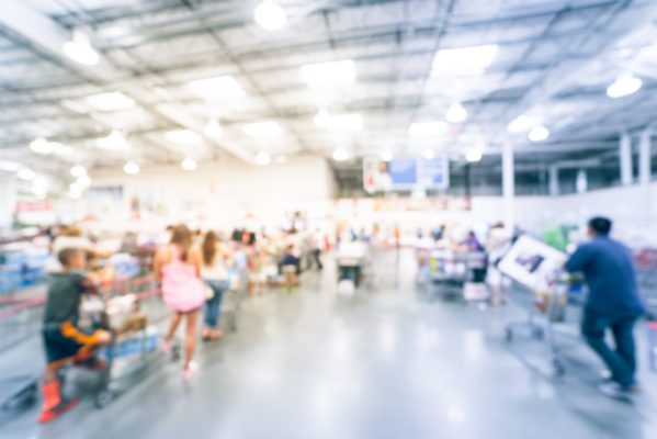 Blurred image of crowded grocery store.